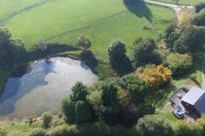 View of private lodge and pond