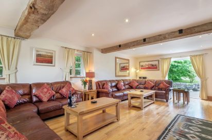 Stunning 27f Sitting Room with double doors opening onto the patio