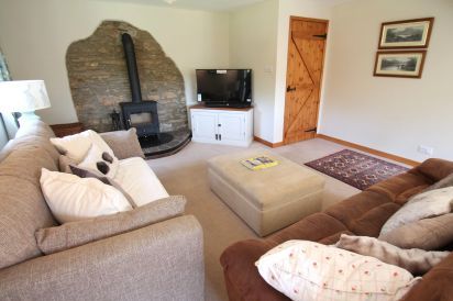 Middle Stolford living room with log burner