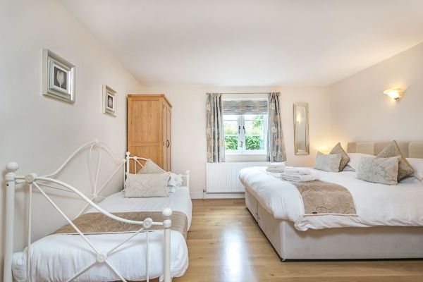 Downstairs bedroom has an full sized additional single bed suitable for children