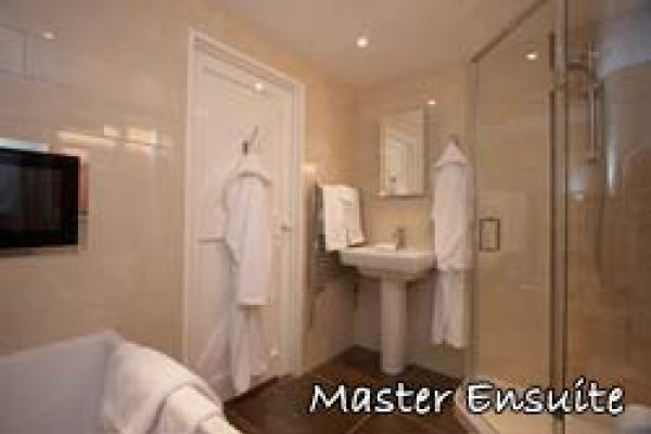 Master suite with TV included in 5 Star luxury cottages Norfolk